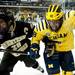 Michigan freshman right wingman Andrew Copp gets rough on the boards in the first period of the game against Western Michigan on Saturday. Daniel Brenner I AnnArbor.com